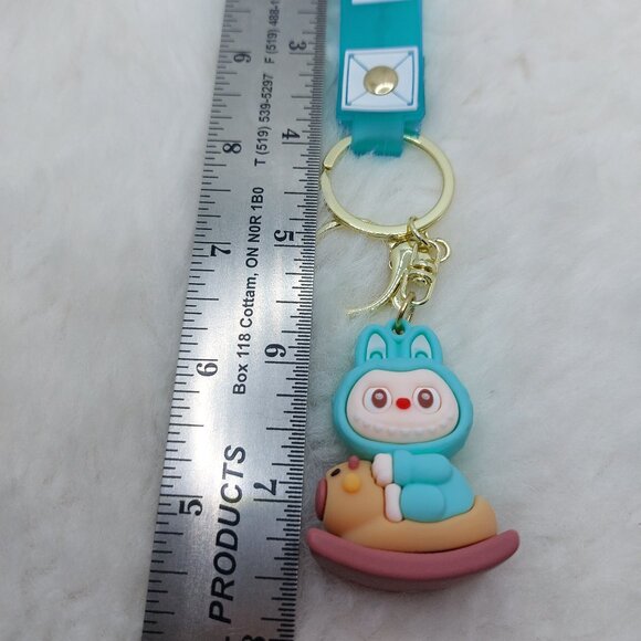 2/$25 Labubu rocking horse blue keychain with strap that reads "Boom!" - Picture 3 of 6